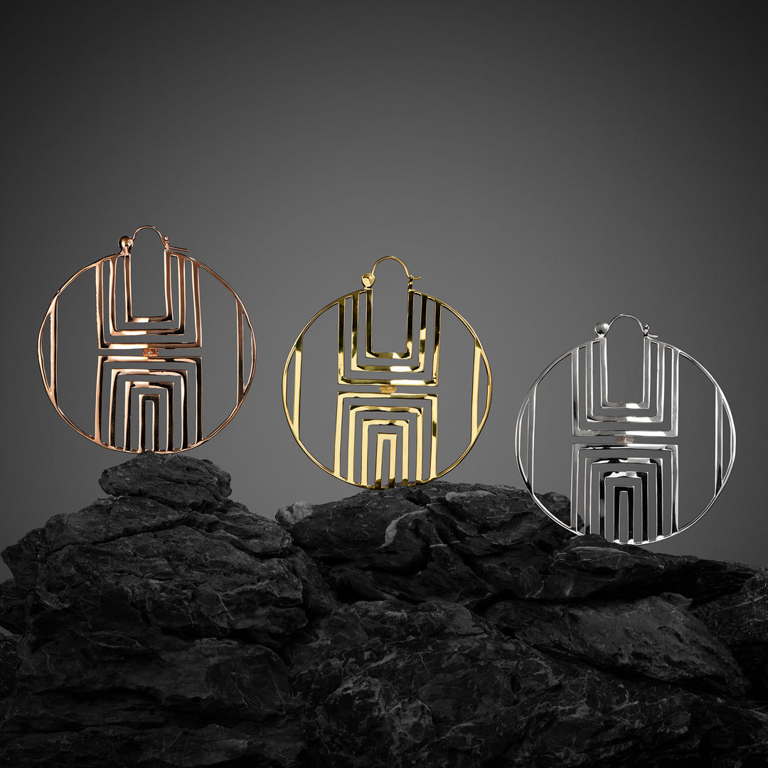 Modern earring hoops with retro flair, geometric cutouts, and a raised diamond design for a head-turning style