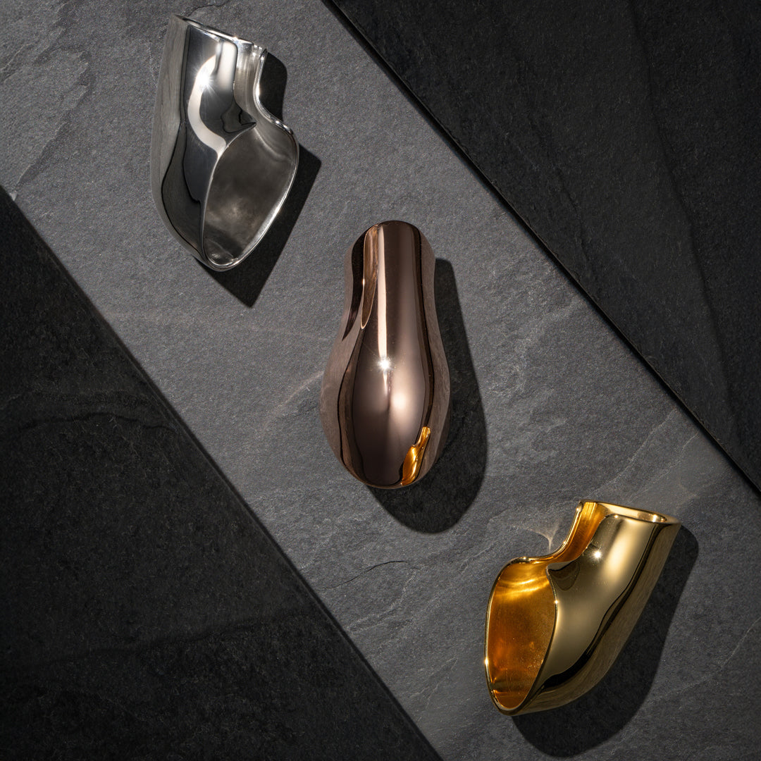 Modern ear cuff—high-shine sterling silver with a mirrored finish for futuristic, statement style.