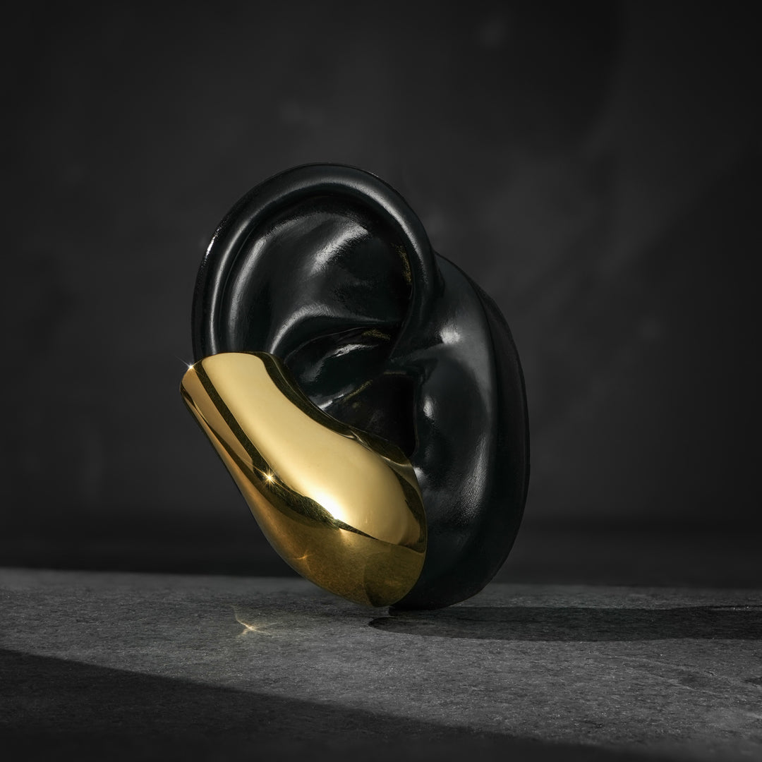 Sci-fi inspired sterling silver ear cuff—effortless elegance with a high-shine mirrored finish.