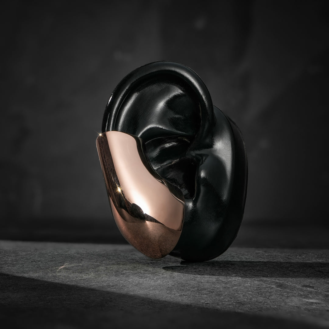 Futuristic sterling silver ear cuff—high-polish mirrored finish, no piercing needed.