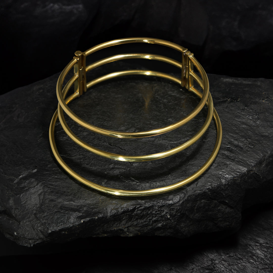 Cosmic Saturn Coil Necklace—eye-catching three-ring choker for bold, interstellar fashion.