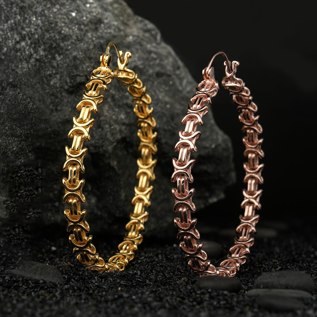 Bold chain mail-inspired earring hoops with a sculptural design, combining modern edge and armor-inspired strength. Fierce, fearless, and designed to stand out.