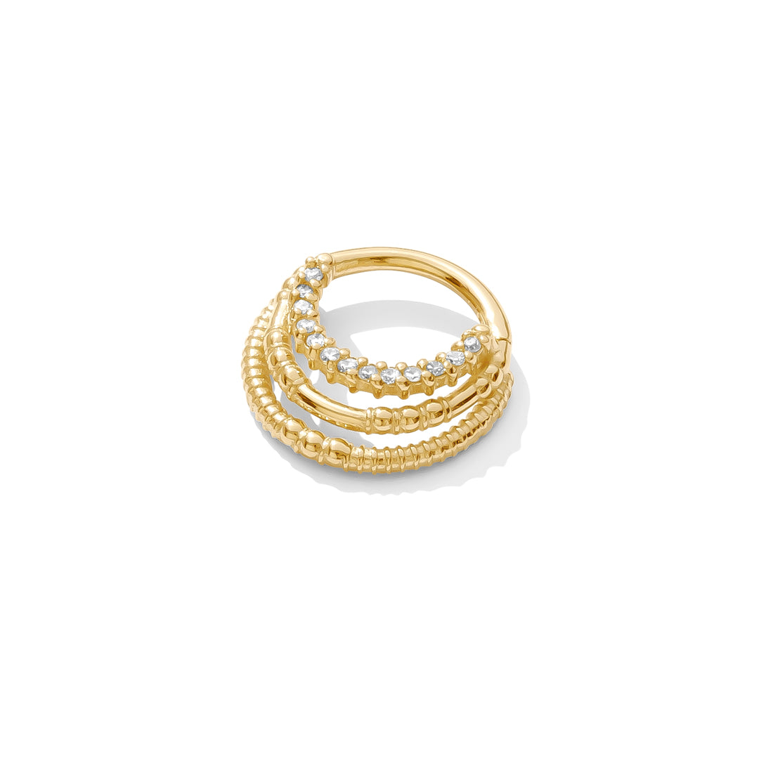 14k yellow gold Harmony Clicker with triple rings and 13 gemstones handcrafted TAWAPA septum jewelry angled view