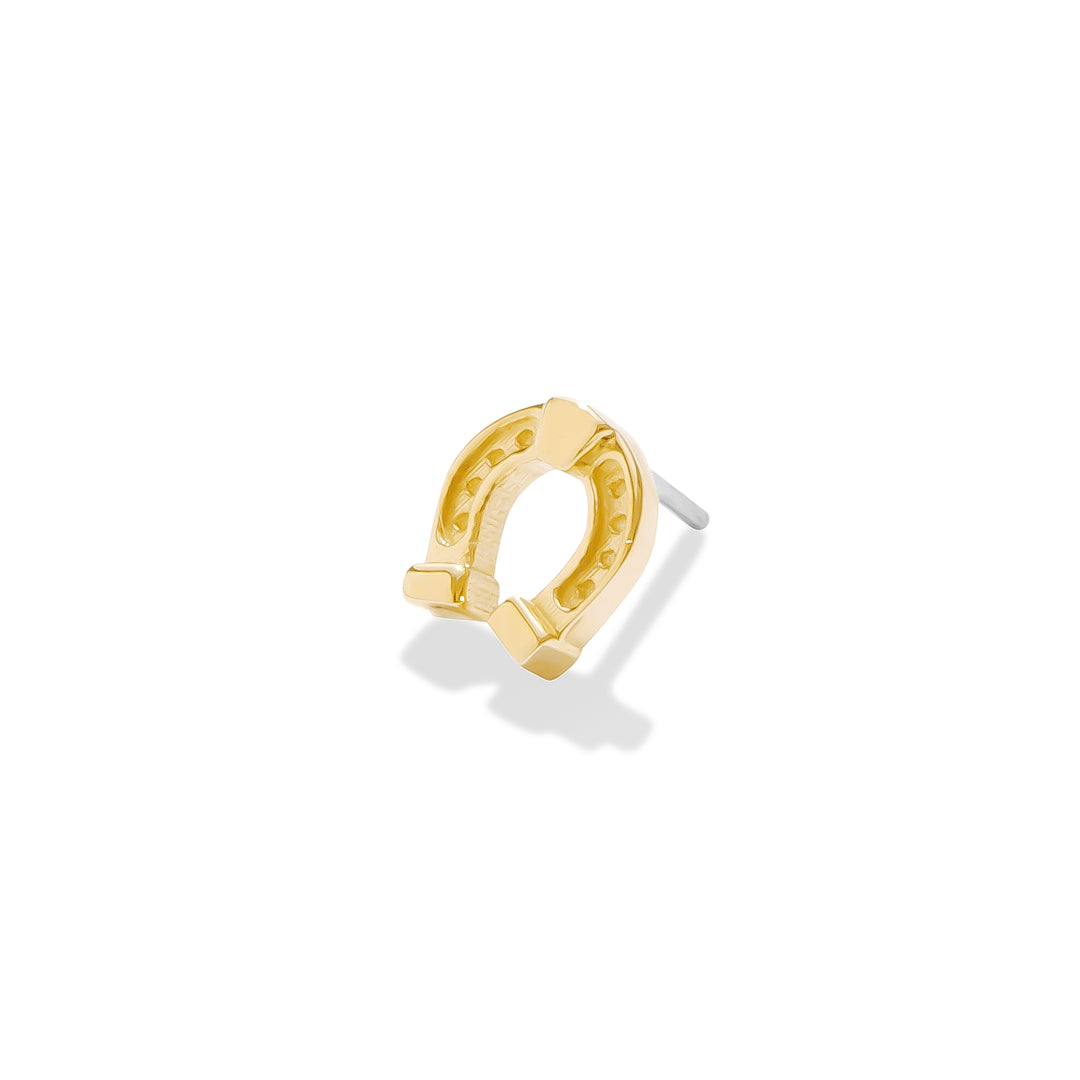 Gold talisman horseshoe jewelry for curated ears