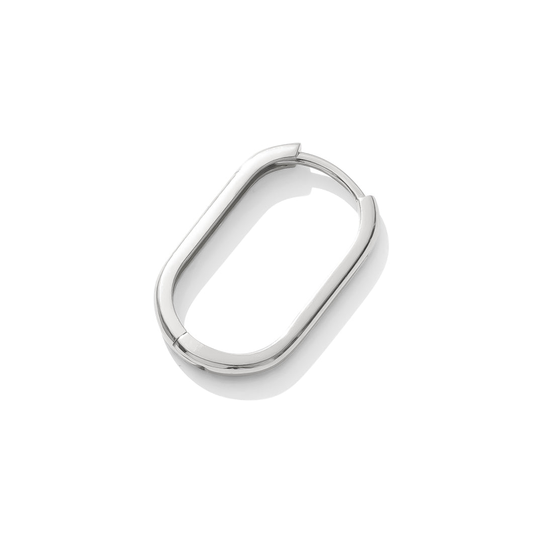 Lola Earring sterling silver with sleek oval shape and squared edges flat lay at an angle, modern minimalist design by TAWAPA