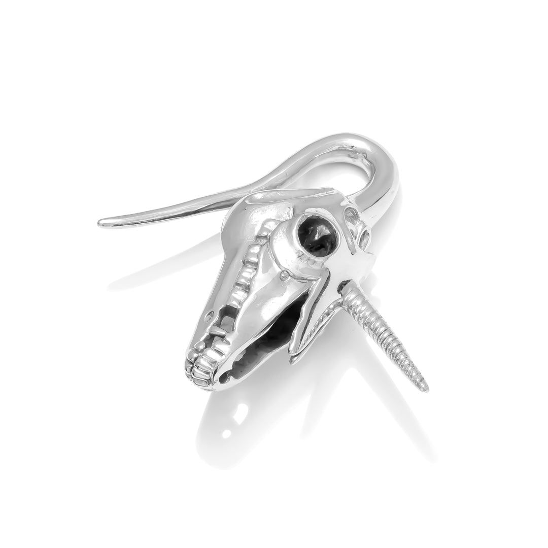 Sculpted unicorn skull hanging weight for stretched lobes handcrafted white brass TAWAPA 3/4 view