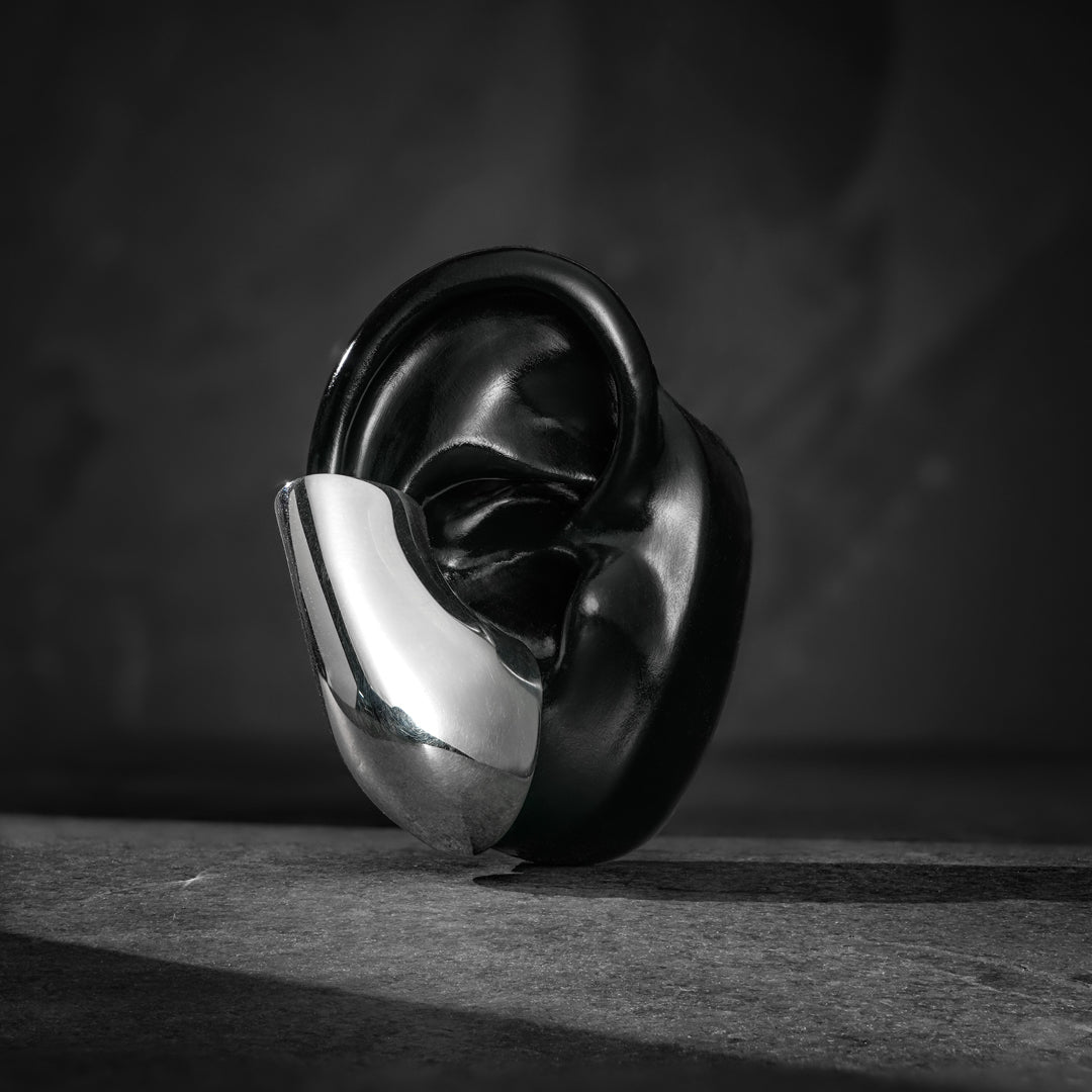 Modern ear cuff—crafted in sterling silver with a high-shine, otherworldly mirrored finish