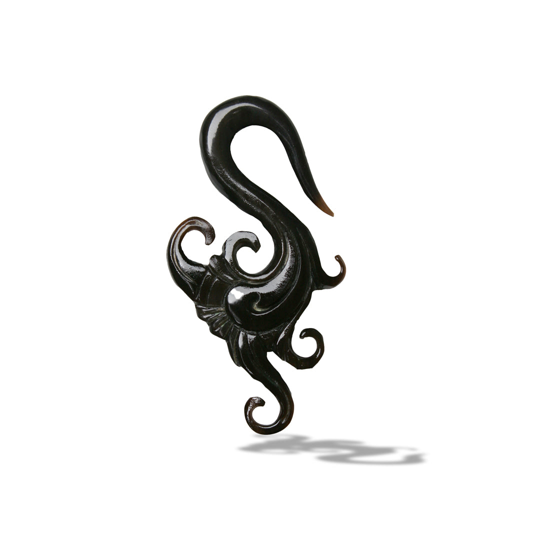 Intricate carved earrings featuring delicate flowers and curls for stretched lobes