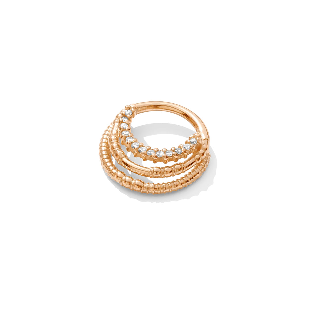 14k rose gold Harmony Clicker with triple rings and 13 gemstones handcrafted TAWAPA septum jewelry angled view