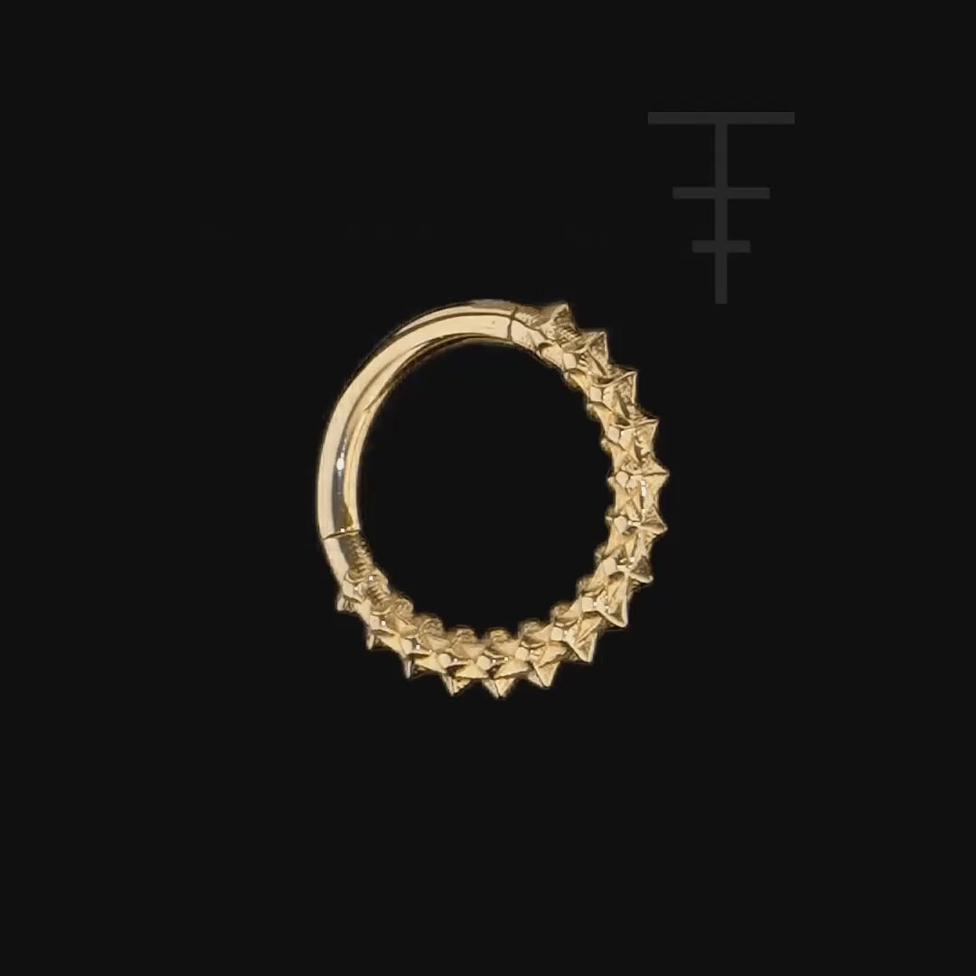 Luxurious 14k gold clicker ring featuring twisted rope texture