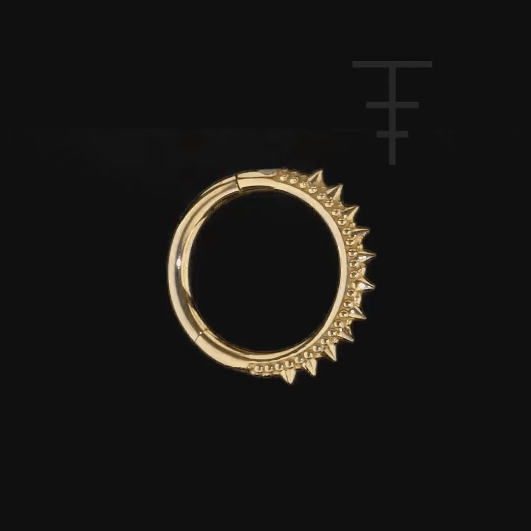 Luxury 14k gold septum clicker with edgy spiked accents and ornate style