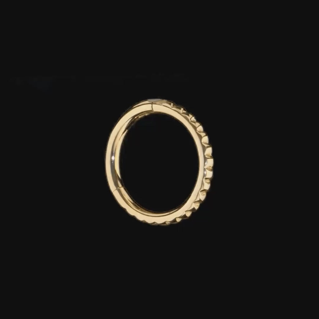 Sleek 14k gold Tokyo Clicker with textured studded detailing